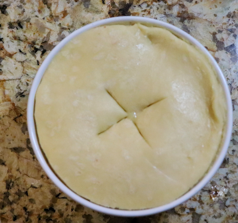 putting an x on the chicken pot pie before baking for venting